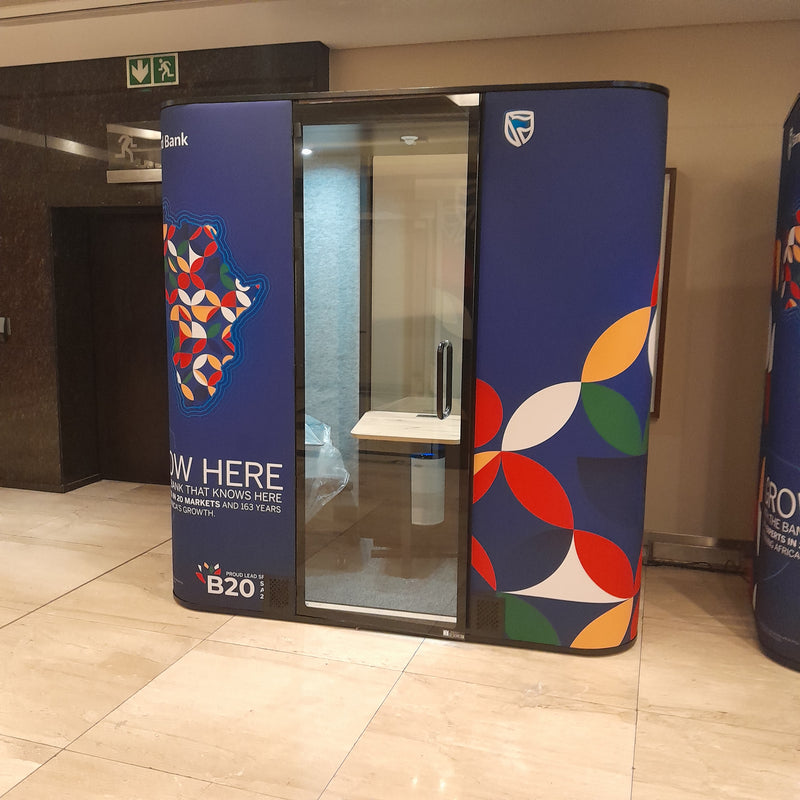 Colorful booth with geometric patterns in a room setting