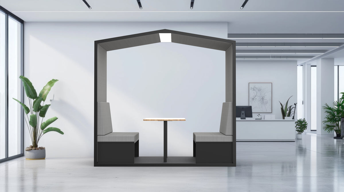 Modern office interior with a hexagonal partition, table, and chairs.