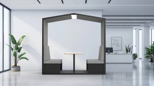Modern office interior with a hexagonal partition, table, and chairs.