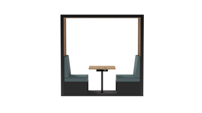 A modern booth seating area with two dark gray upholstered chairs facing a small square light wood table, set within a black-framed alcove on a white background.