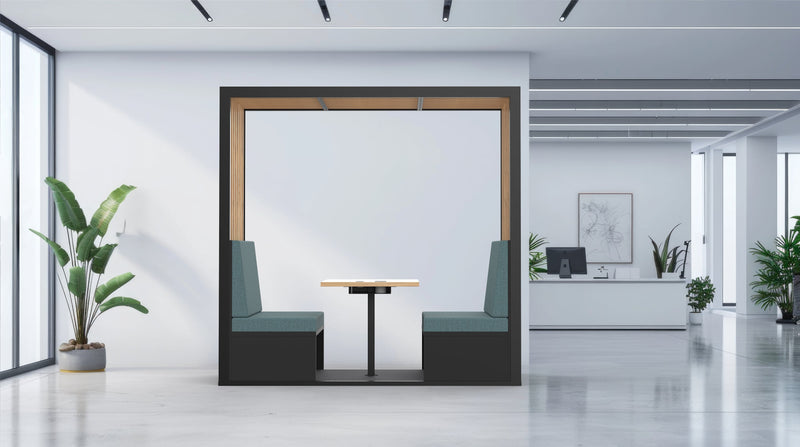 Modern office interior with a glass partition, desk, and plants.