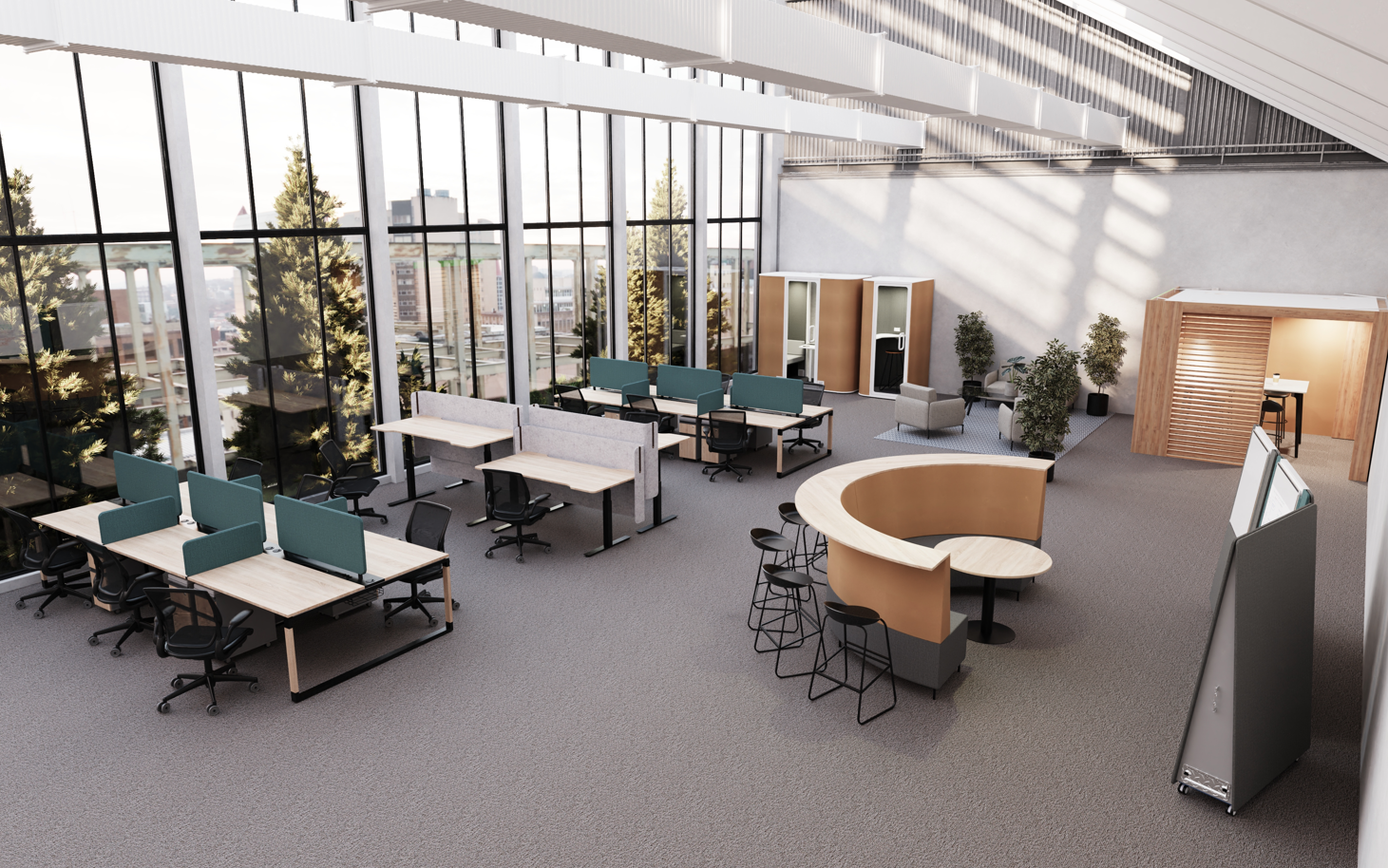 Modern office space with desks, chairs, and a curved meeting table.